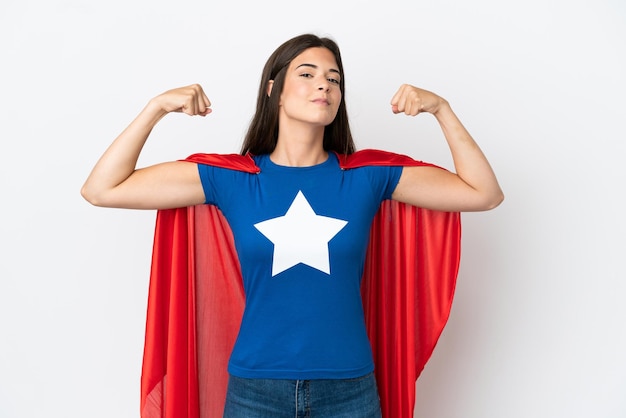 Young Brazilian woman isolated on white background in superhero costume and doing strong gesture