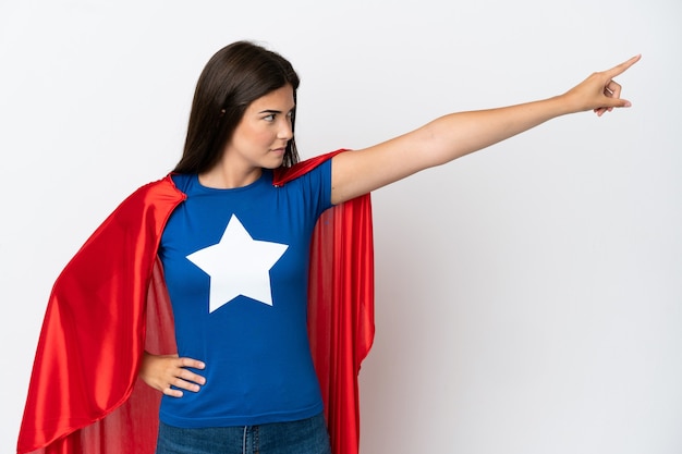 Young Brazilian woman isolated on white background in superhero costume with proud gesture