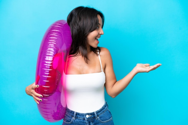 Young brunette hispanic woman on isolated background