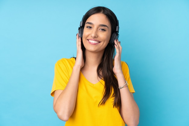 Young brunette woman listening music