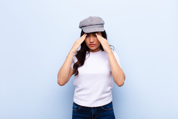 young brunette woman looking stressed and frustrated