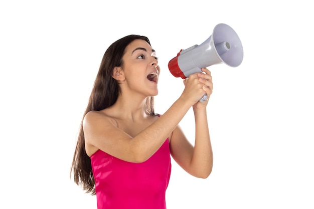 Young brunette woman shouting with a megaphone