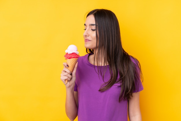 Young brunette woman with a cornet ice cream