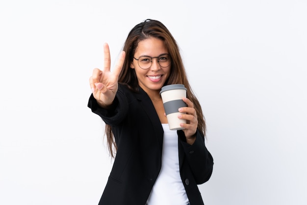 Young business Brazilian girl  holding coffee to take away