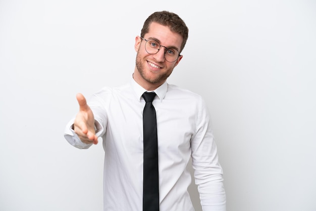 Young business caucasian man isolated on white background shaking hands for closing a good deal