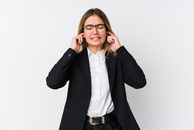 Young business caucasian woman covering ears with hands.