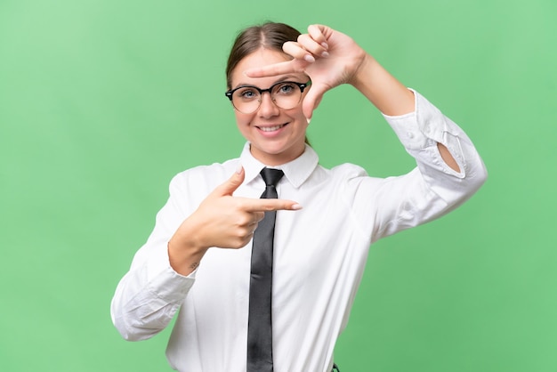 Young business caucasian woman over isolated background focusing face Framing symbol