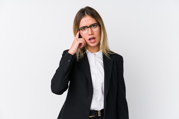 Young business caucasian woman showing a disappointment gesture with forefinger.