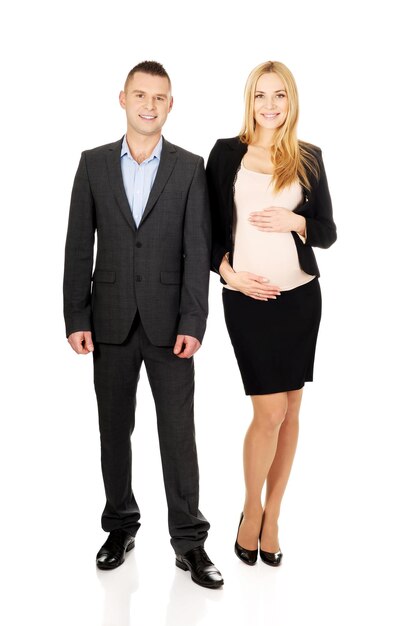 Photo young business couple standing against white background