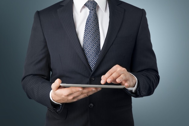 Young business man holding digital tablet