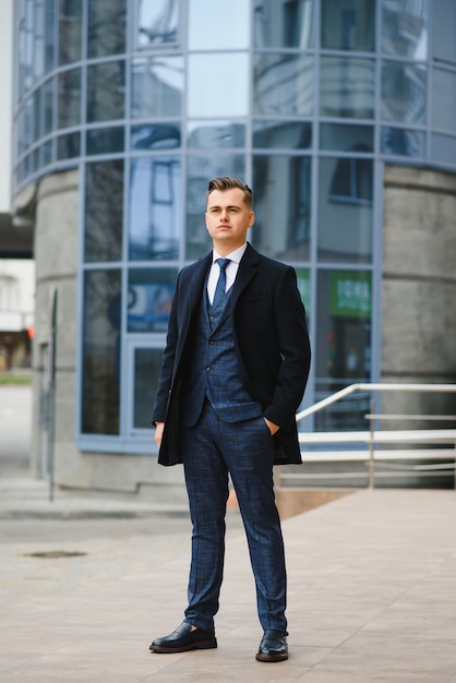 Young business man, wearing stylish classic suit