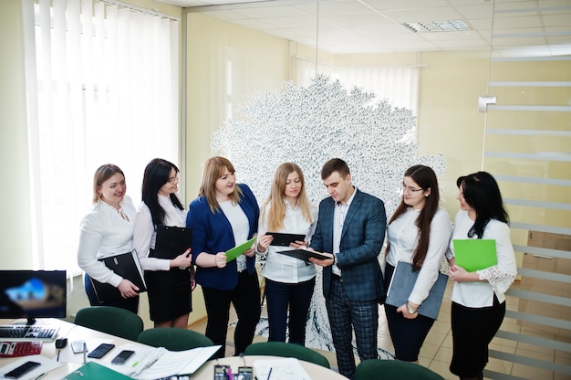 Young business people group of bank workers with clipboards have meeting and working in modern office.