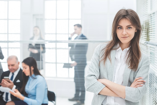 Young business woman standing in a modern office. photo with copy-space