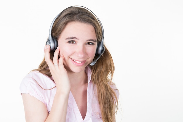 Young business woman student girl with headset in office happy and smiling customer support operator isolated on white background