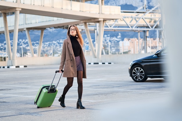 Young business woman walking