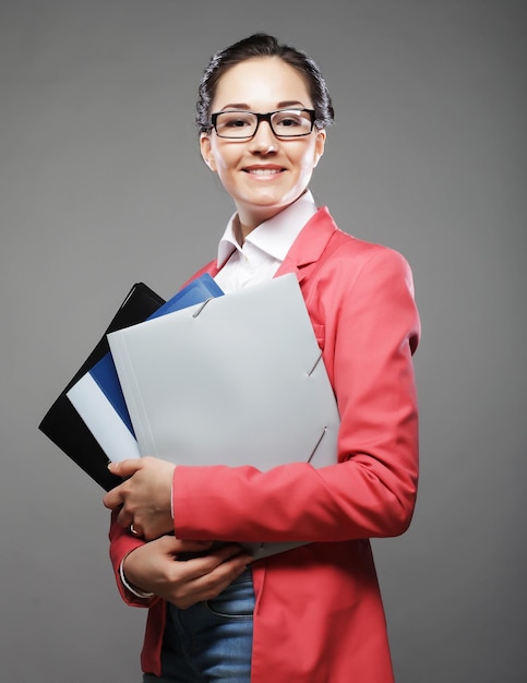 Young business woman with folders