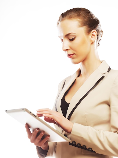 Young business woman working on tablet