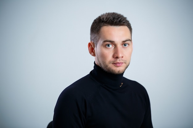 Young businessman in black golf and jeans