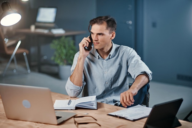 Young businessman discussing business issues on a smartphone