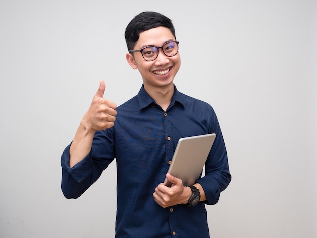 Young businessman hold tablet gentle smile show thumb up isolated