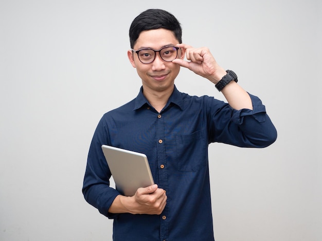 Young businessman looking confident hold tablet portrait isolated