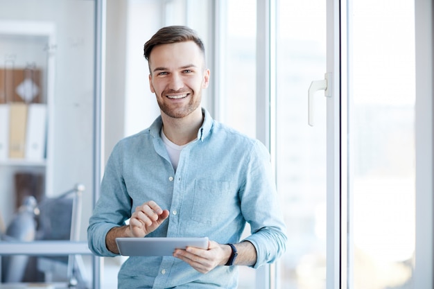 Young Businessman Posing by Window