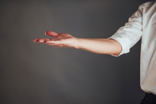 Young businessman showing empty hands