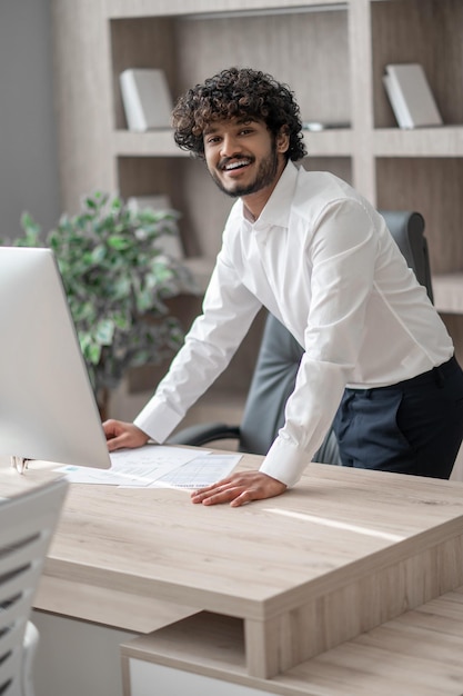 Young businessman in white shirt in the office