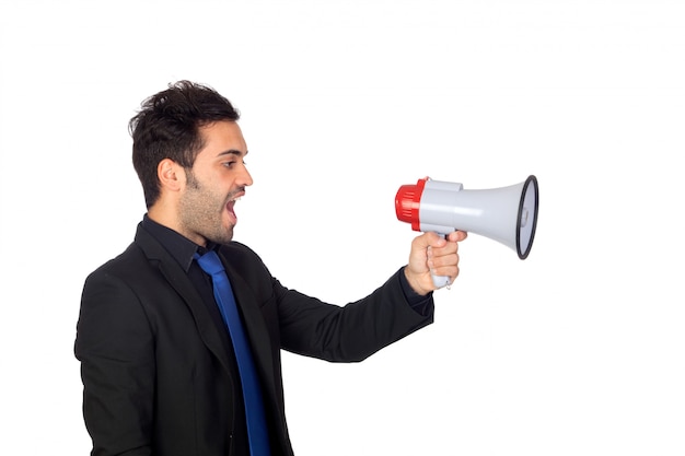 Young businessman with a Megaphone proclaiming something isolated on white background