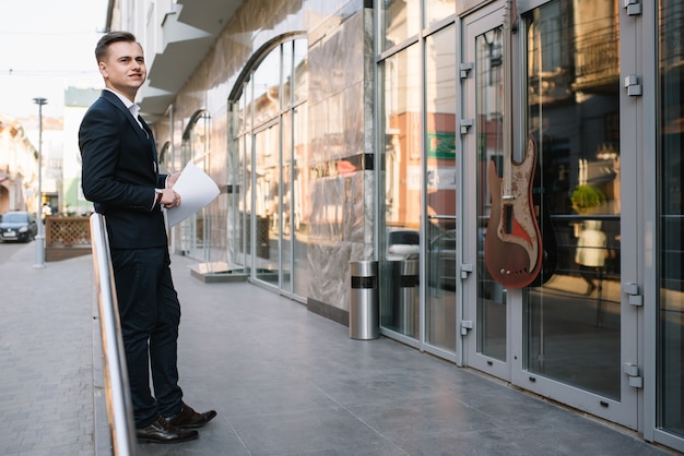 Young businessman with paperwork