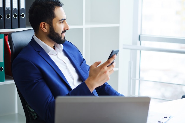 Young Businessman Working On Computer In Office