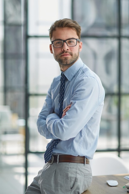 Young businessman working at modern glass office