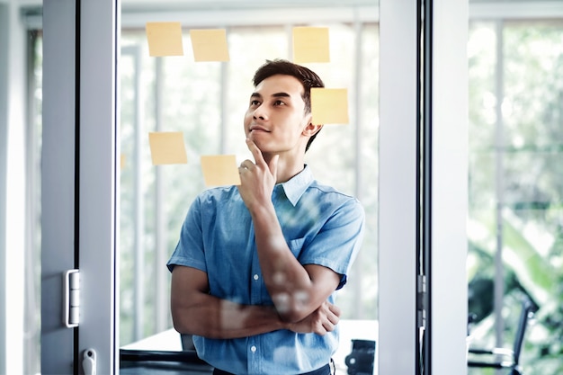 Young Businessman Working in Office Meeting Room. Data Planning and Project