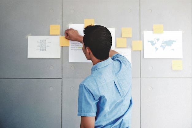 Young Businessman Working in Office Meeting Room. Data Planning and Project