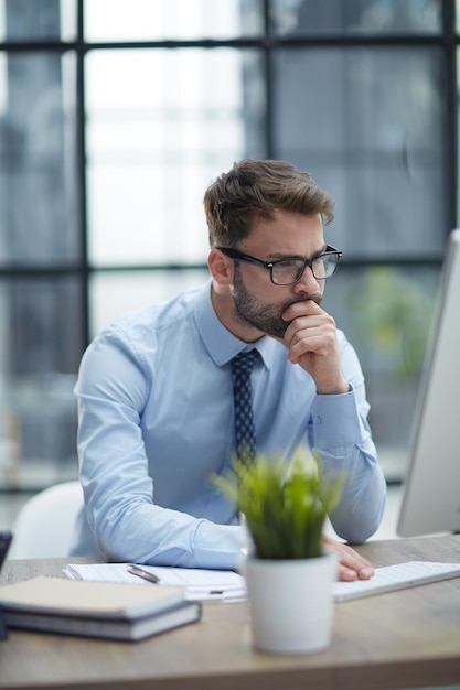 Young businessman working at office