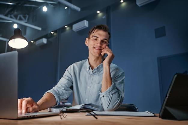 Young businessman works in the office overtime at night