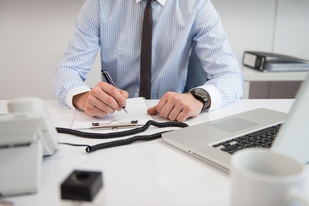 Young Businessman Writing A Letter Close Up  Notes Or Correspondence Or Signing A Document Or Agreement