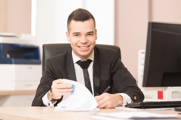 Young Businessman Writing A Letter  Notes Or Correspondence Or Signing A Document Or Agreement