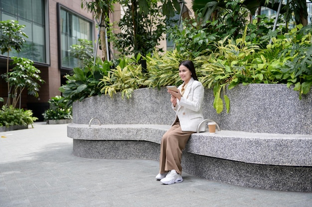 A young businesswoman is working in modern city downtown of Singapore