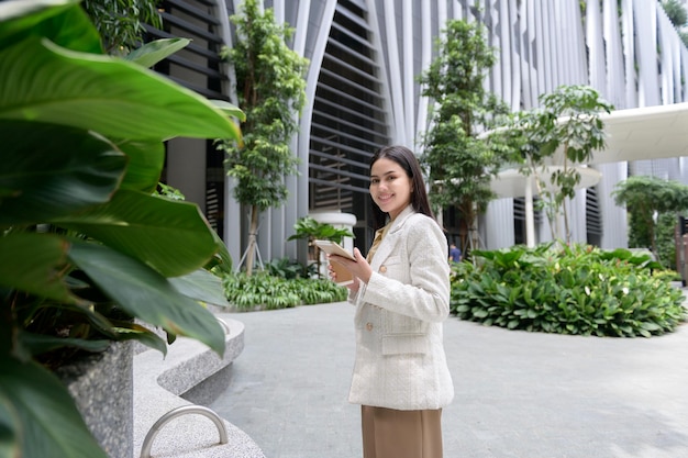 A young businesswoman is working in modern city downtown of Singapore