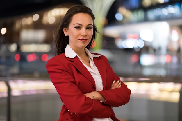 Young businesswoman portrait in a modern city setting at night