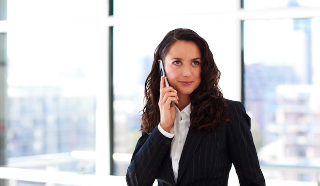 Young businesswoman talking on phone