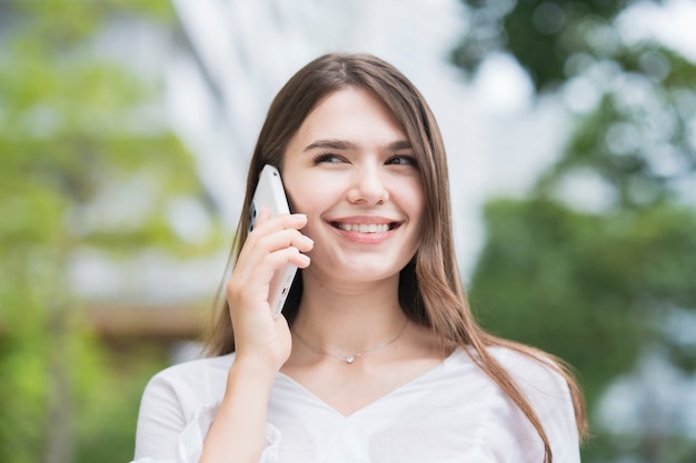 Young businesswoman using the smartphone