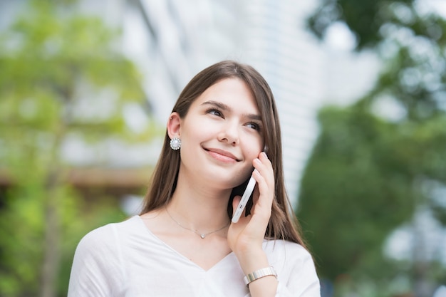 Young businesswoman using the smartphone