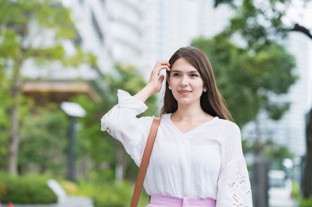 Young businesswoman walking outdoors