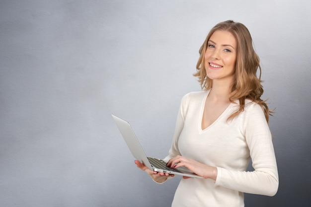 Young businesswoman with laptop