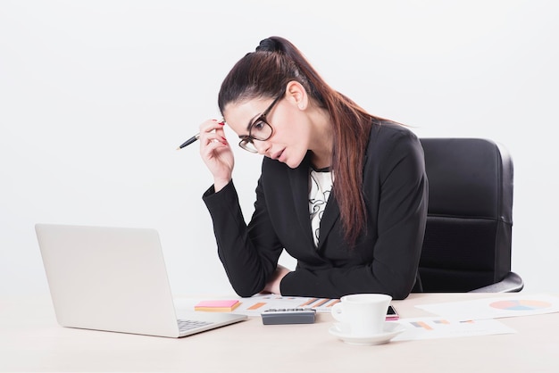 Young businesswoman at work isolated on white