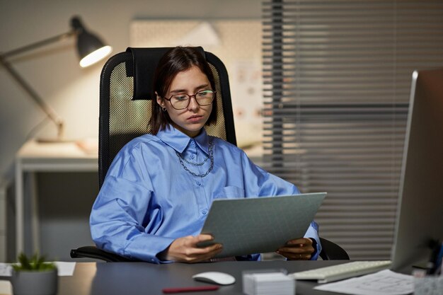 Young Businesswoman Working at Night