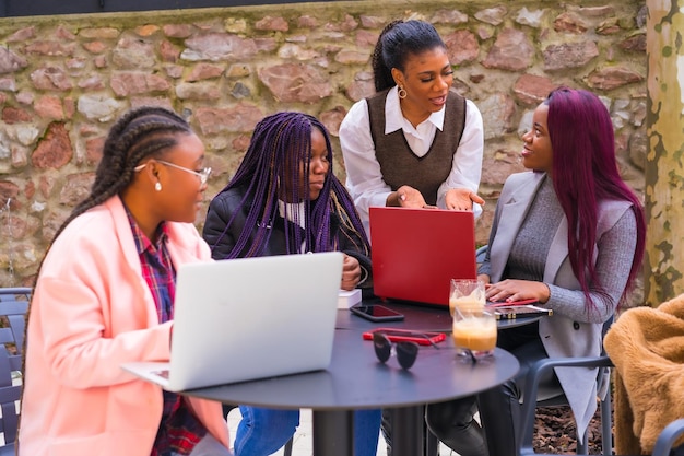 Young businesswomen of black ethnicity In a business meeting in a cafeteria