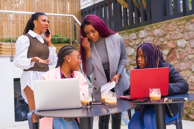 Young businesswomen of black ethnicity In a business meeting in a cafeteria